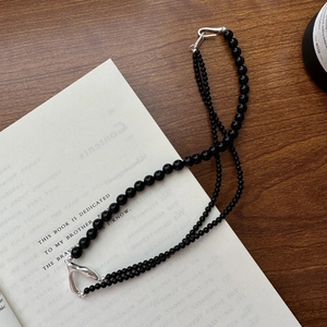 Minimalist S925 sterling silver double-layer black beaded Y-necklace on vintage book