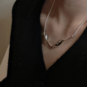 Minimalist S925 sterling silver necklace with organic wave pendant on model