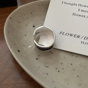 Adjustable S925 sterling silver ring with black enamel finish and minimalist texture