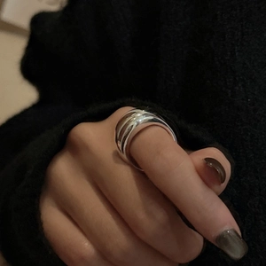 Minimalist S925 sterling silver wide polished ring shown on finger with sleek finish