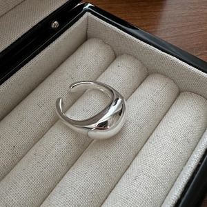 Polished S925 sterling silver open ring with a minimalist teardrop design in a jewelry box