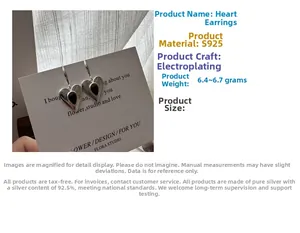 Detailed view of S925 sterling silver heart earrings with black teardrop inlay decor
