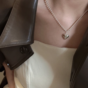 Minimalist S925 sterling silver heart necklace with asymmetric chain on model