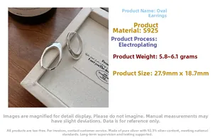 Macro detail of S925 sterling silver oval hoop earring in a white gift display box