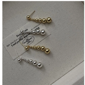 Detailed view of S925 silver gradient beaded earrings in gold and silver finishes