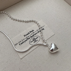 Minimalist S925 silver heart necklace with unique bead and snake chain design