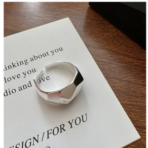 Detailed view of an S925 sterling silver geometric faceted ring with a matte finish