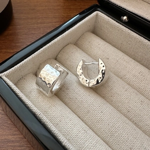 S925 sterling silver hammered earrings with unique texture on premium linen display