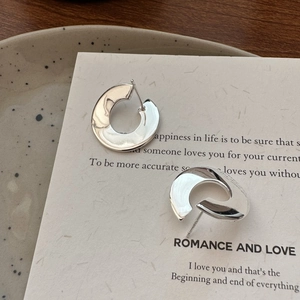 Minimalist S925 sterling silver C-shaped hoop earrings with a high-polished metallic finish