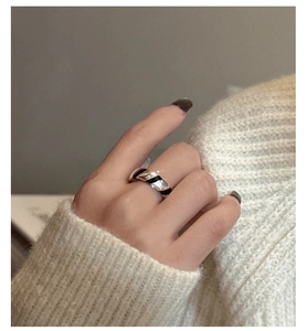 Detail of vintage S925 sterling silver ring with black enamel diagonal wave patterns