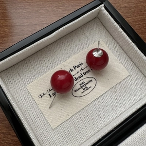 S925 sterling silver red shell pearl stud earrings shown in a classic jewelry box