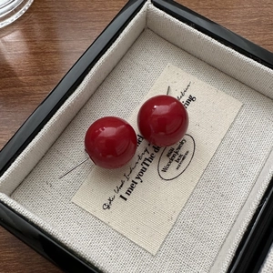 Elegant S925 sterling silver red shell pearl stud earrings shown in a premium jewelry box
