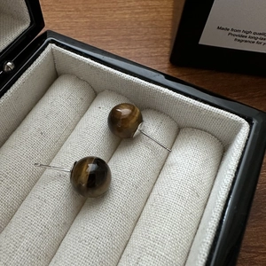 Elegant S925 silver stud earrings featuring polished tiger eye stones in brown tones