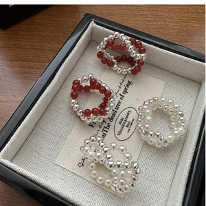 Set of four S925 silver beaded rings with red and white pearls in a jewelry gift box