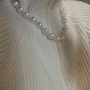 Elegant S925 sterling silver pearl necklace styled on a beige turtleneck sweater