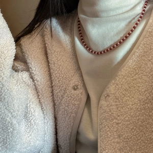 S925 sterling silver necklace with red agate and pearls on model in winter outfit