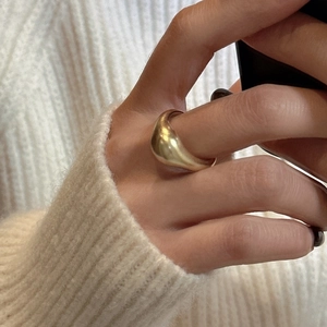 Minimalist S925 sterling silver dome ring with matte gold finish worn on finger