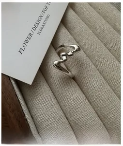 Detailed view of the S925 sterling silver wavy ring on a velvet jewelry display tray