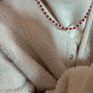 S925 sterling silver red agate and pearl beaded necklace on model with beige coat