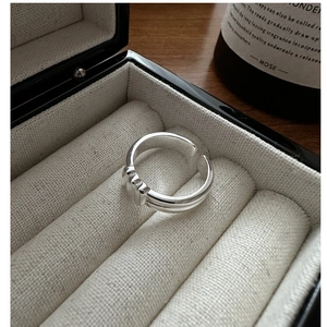 Detail of S925 sterling silver double-layered open ring on elegant display