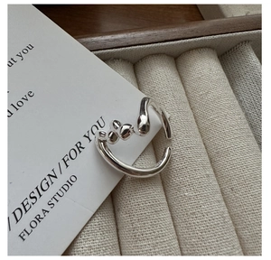 Macro detail of silver S925 ring featuring an organic melt texture and adjustable open band