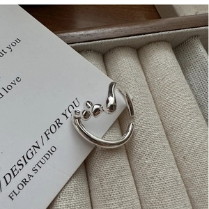 Detail of S925 sterling silver liquid metal ring with abstract heart shape design
