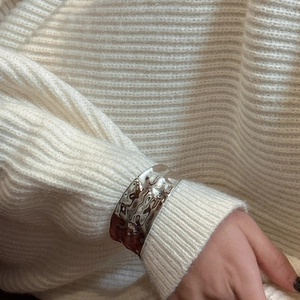 Polished S925 sterling silver wide cuff bracelet with irregular water ripple texture on model