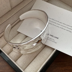 S925 sterling silver wide cuff bracelet featuring hammered texture and cartoon engravings