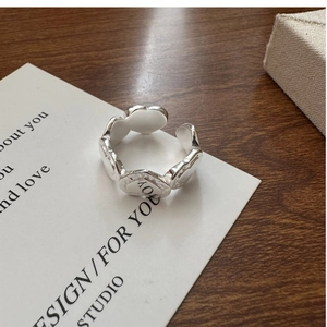 Detail of S925 sterling silver heart ring with LOVE engraving and adjustable open design