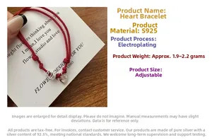 Detailed macro view of S925 sterling silver heart charm on a red braided string bracelet