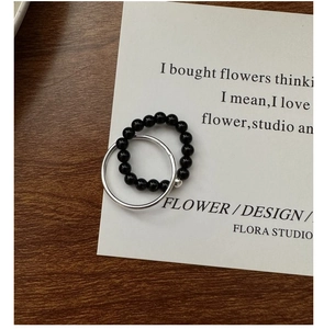 Detail of S925 sterling silver minimalist double layer ring set with black beads