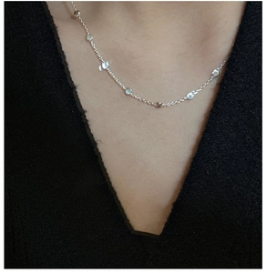 Detail of S925 sterling silver beaded choker necklace showing elegant fit on the neck