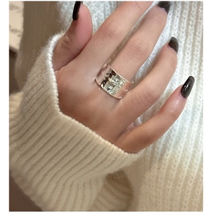 Detailed view of wide textured S925 sterling silver ring with water ripple surface