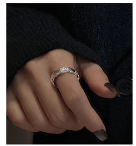 Macro detail of S925 silver ring featuring geometric engravings and a square zircon stone