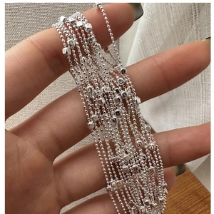 Close-up of S925 sterling silver multilayer chain with polished beads and cubes