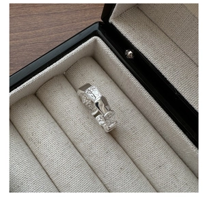 Detailed view of the S925 sterling silver ring with unique scale texture in a black gift box