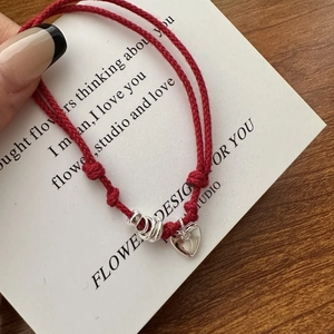 Minimalist S925 sterling silver red rope bracelet with heart pendant on white card