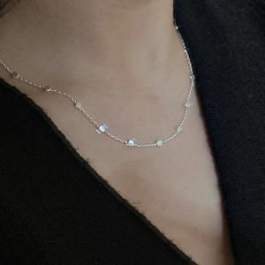 Elegant S925 sterling silver beaded choker necklace on model with dark blazer