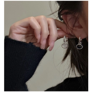 Close-up of S925 sterling silver drop earrings with frosted chalcedony on a model