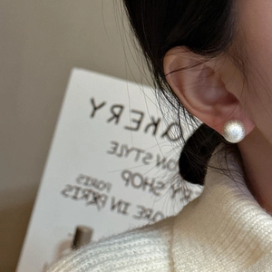 Minimalist S925 sterling silver ball earring with brushed texture on female model