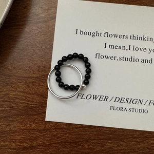 Minimalist S925 sterling silver double layer ring set with black beads on wooden surface