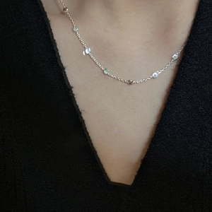Minimalist S925 sterling silver ball bead necklace worn over a black V-neck top