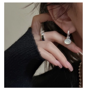 Detail view of S925 silver hoop earrings with white chalcedony drop and textured band ring
