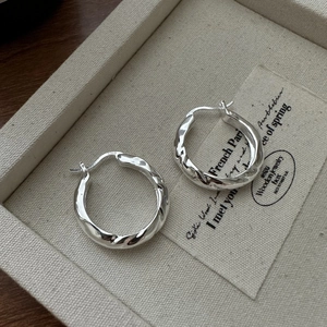 Minimalist S925 sterling silver hoop earrings with a unique twisted textured design
