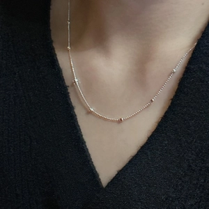 Minimalist S925 sterling silver beaded chain necklace worn on a female model