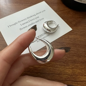 Polished silver S925 sterling silver U-shaped drop earrings with a minimalist liquid metal design