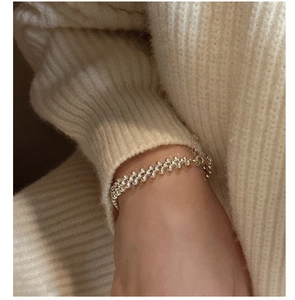 Close-up of S925 sterling silver triple-layer woven bead bracelet on woman's wrist