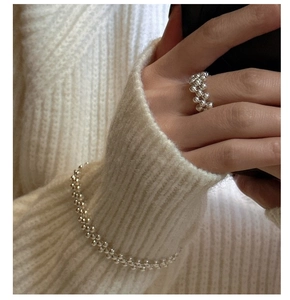 Detailed view of S925 sterling silver beaded triple-layer woven bracelet and matching ring