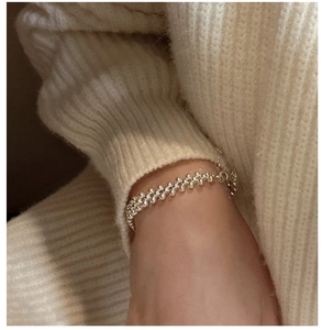 Detailed close-up of S925 sterling silver triple-layer woven bead bracelet on a wrist