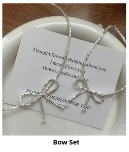Macro detail of S925 sterling silver bowknot necklace set with elegant bead chain